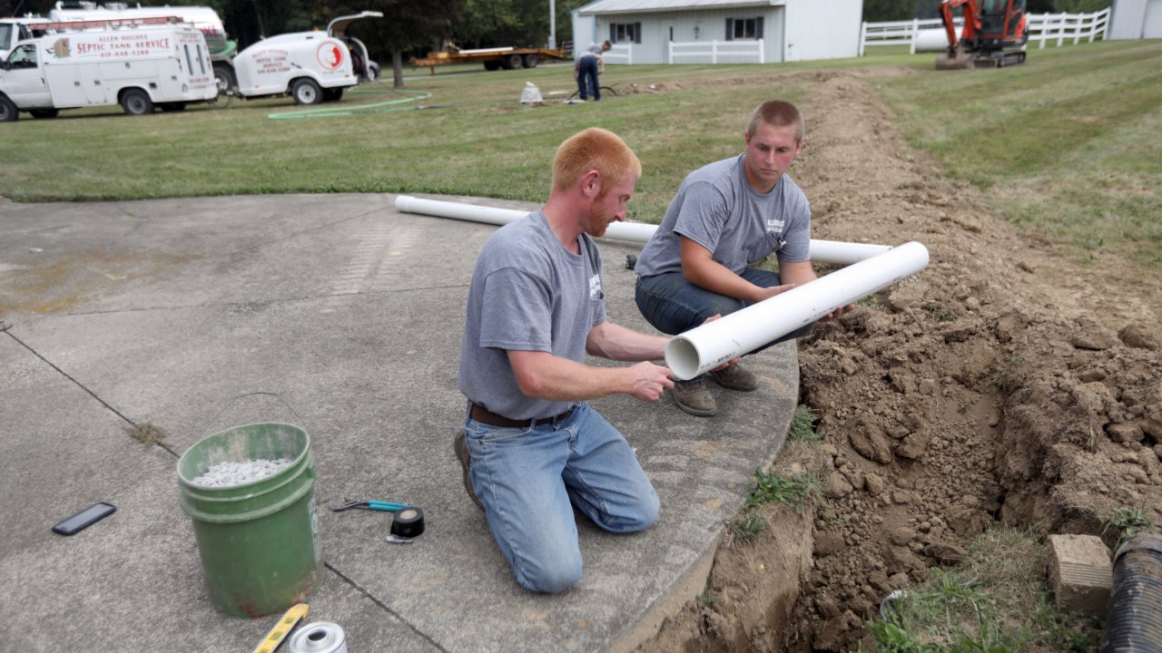 Plumbers working on a job